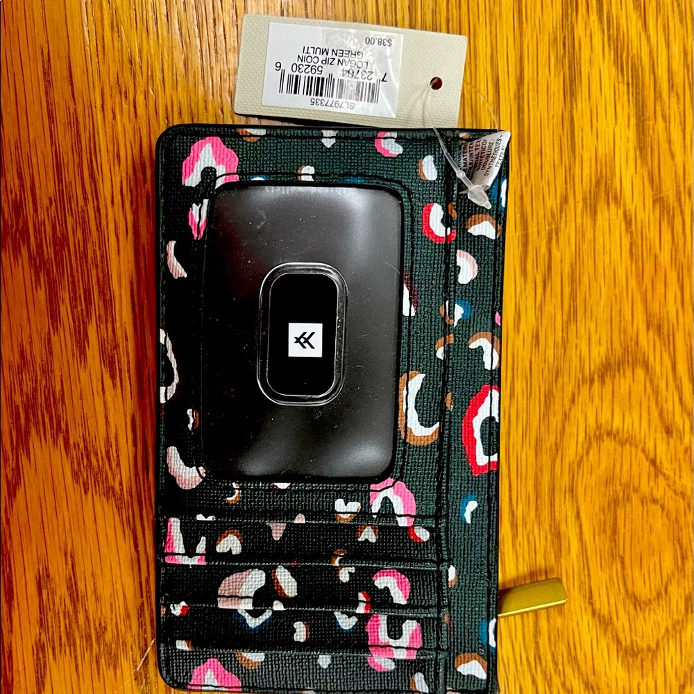 NWT Fossil wallet paid $38.00 navy blue with abstract print. Zipper change purse